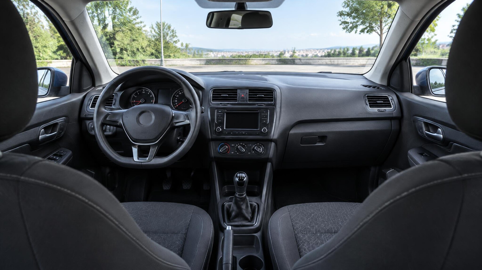 Steering wheel and dashboard inside a car
